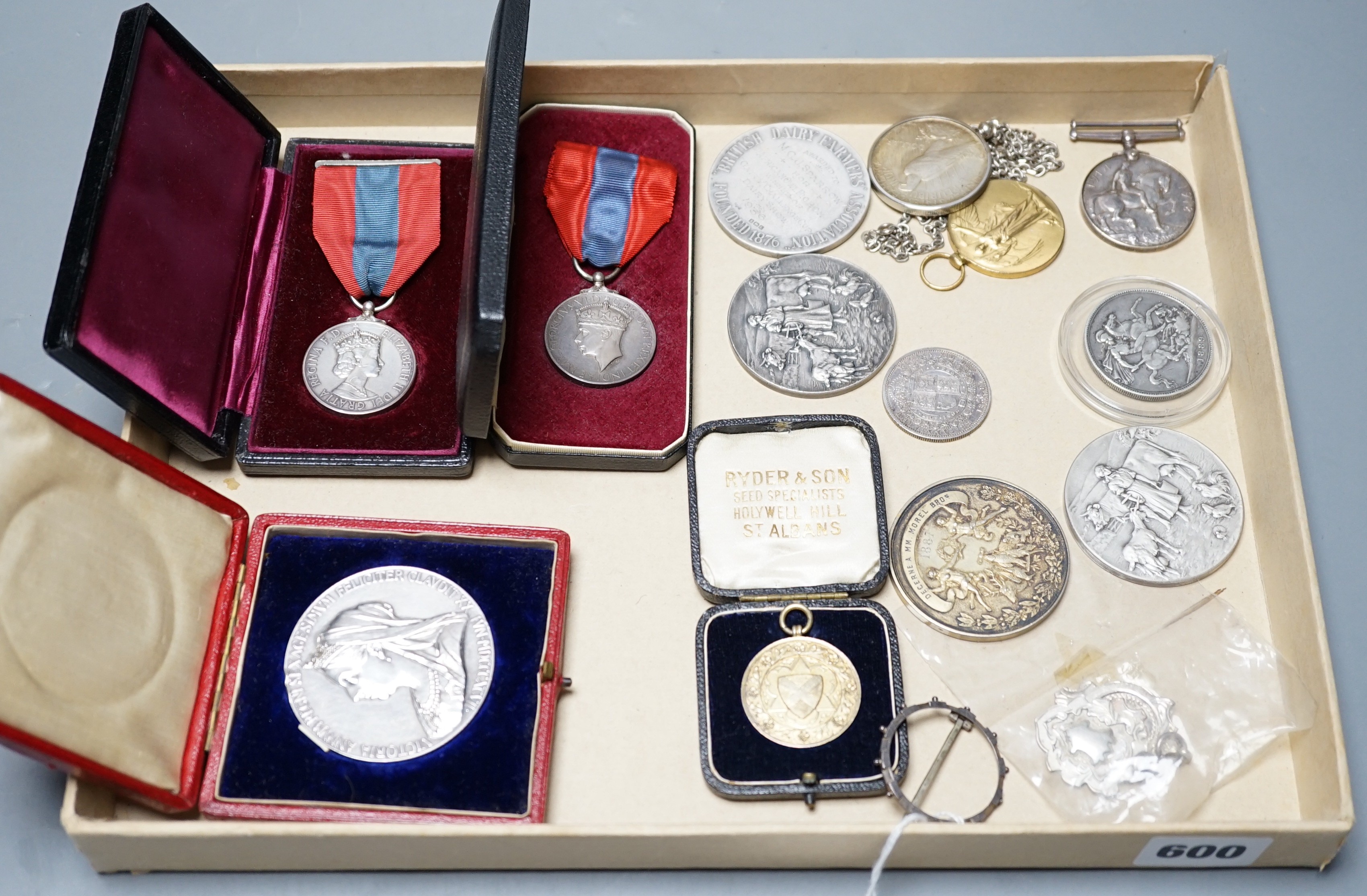 A group of silver commemorative medals, a Victoria 1889 crown, 1880 halfcrown, two cased ISM and to WW1 medals